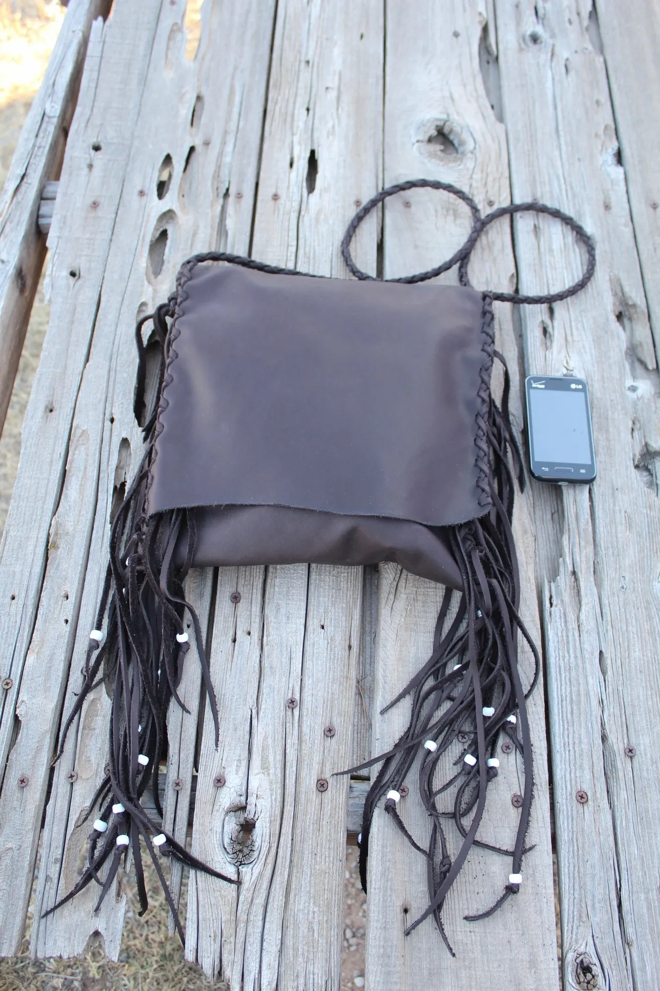 Brown leather handbag, fringed boho hippie style crossbody bag