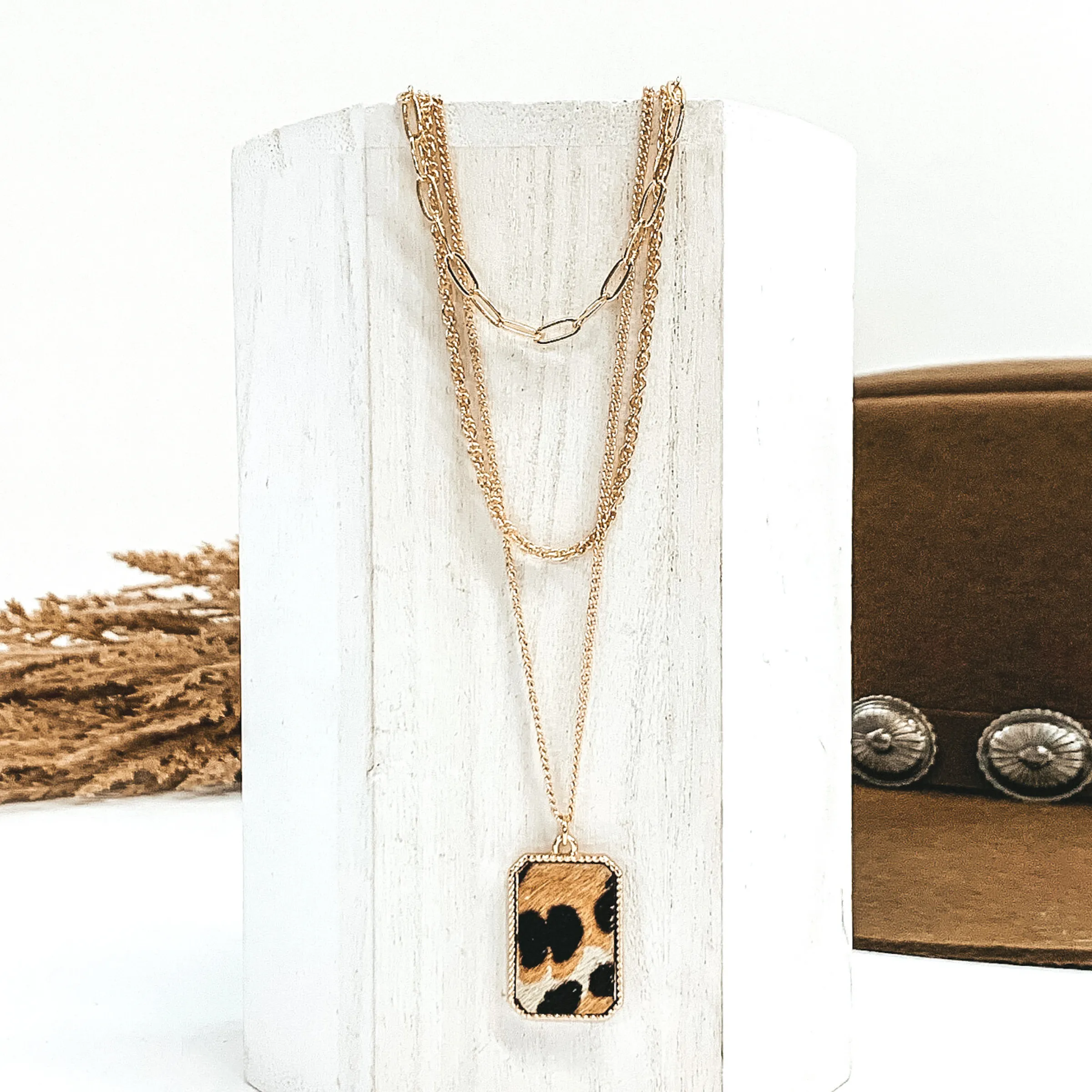 Gold Multi Chain Necklace with a Rectangle Pendant in Ivory Animal Print