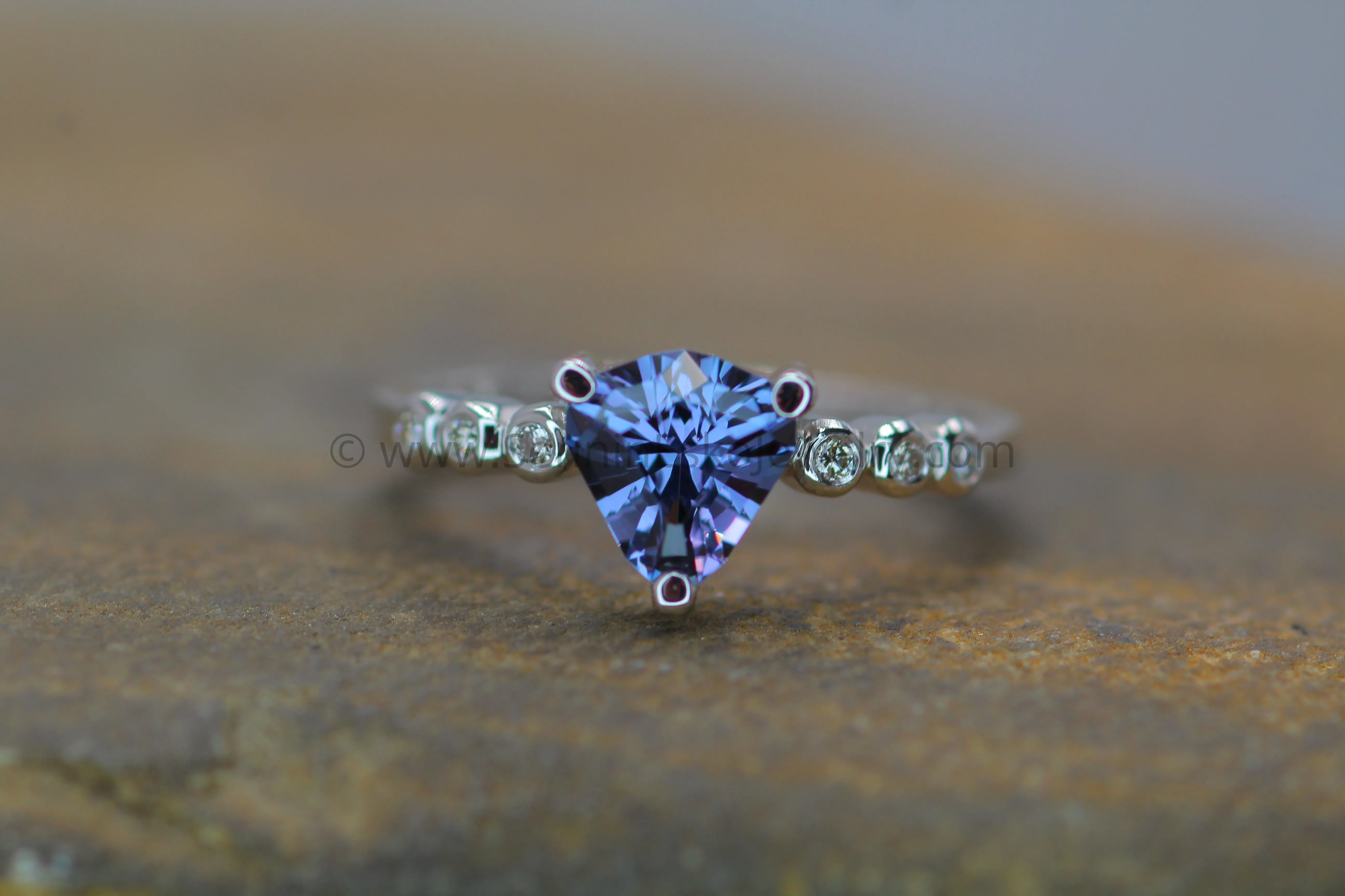 Seven Stone Diamond Accented Prong Setting - Depicted with a Lilac Spinel (Setting Only, Center Stone Sold Separately)